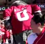 Big Al mascot of the University of Alabama having fun with band